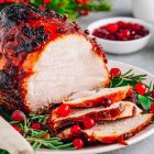 Christmas Glazed Ham with cranberry sauce. Roasted Holiday Pork